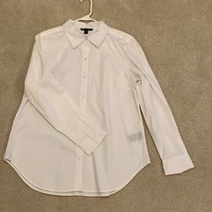 Women’s long sleeved white blouse.